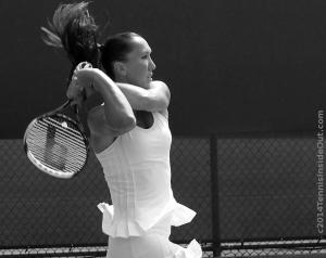 Jelena Jankovic practice Western and Southern Open Cincinnati 2014 black and white ruffled dress backhand swing flying ponytail photos pictures images